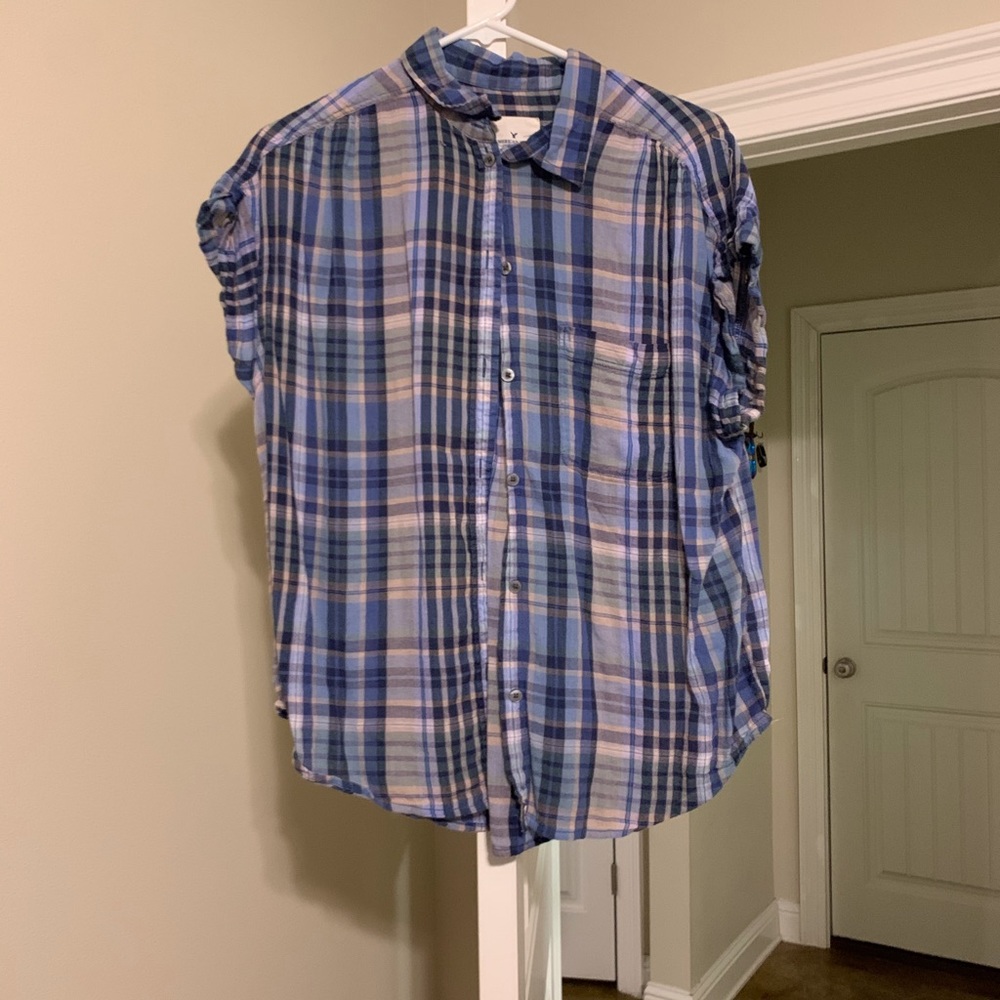 Plaid button up shirt.